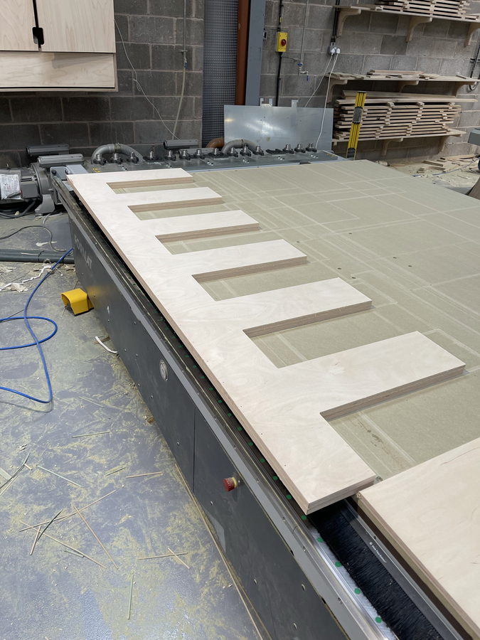 Pocket cut-outs machined into a primed panel