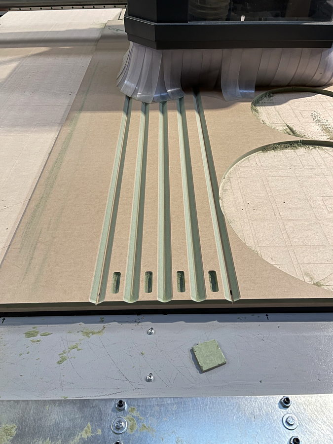 Cutting the slots, the dust shoe following the head