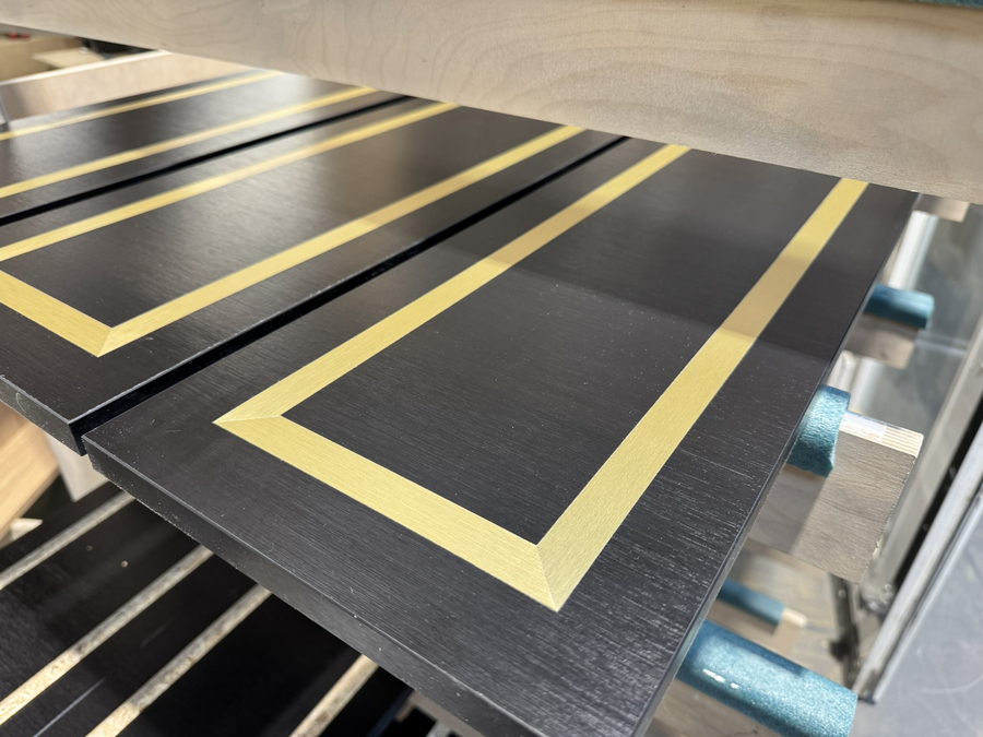 The batch racked up, inlay borders catching the light