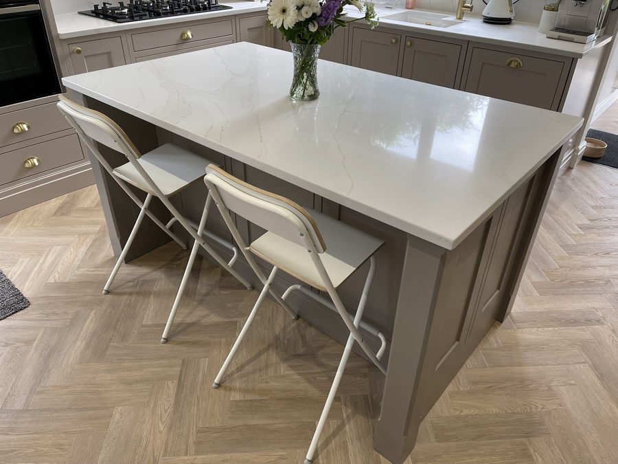 A quartz-topped island doing duty as the breakfast table