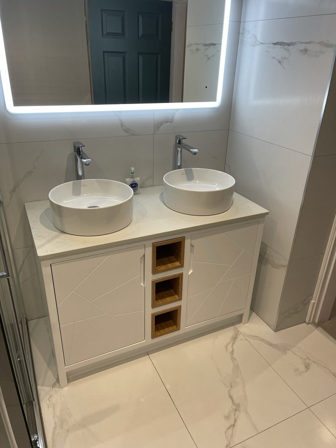 Cream doors, oak cubbies and marble-effect tiling