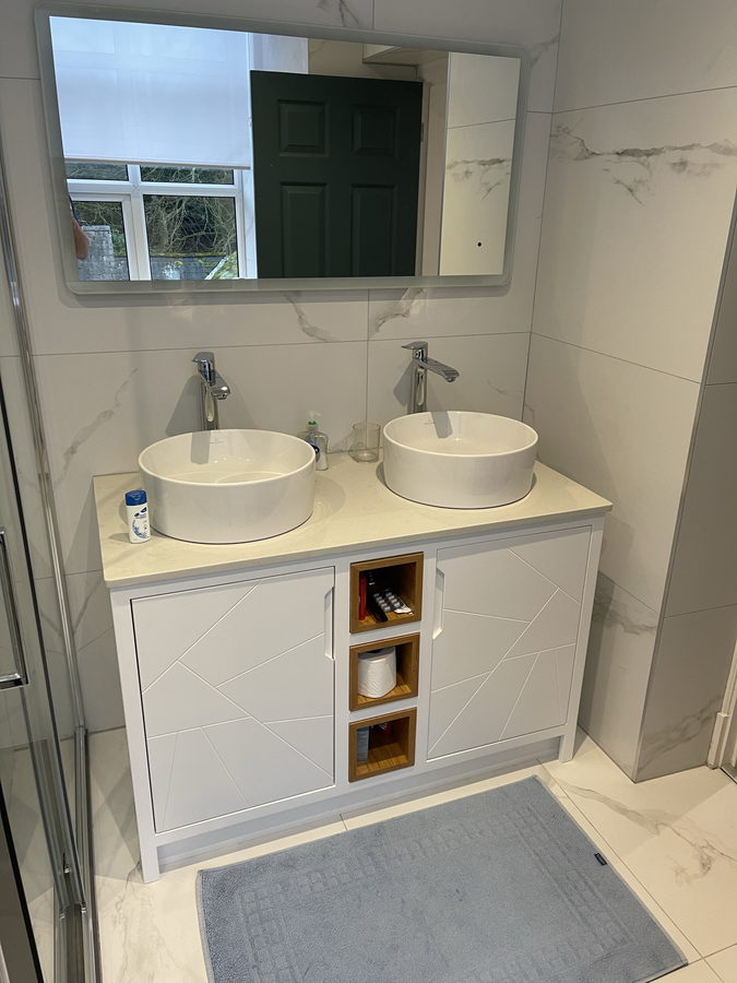Oak cubbies stacked beside the basins