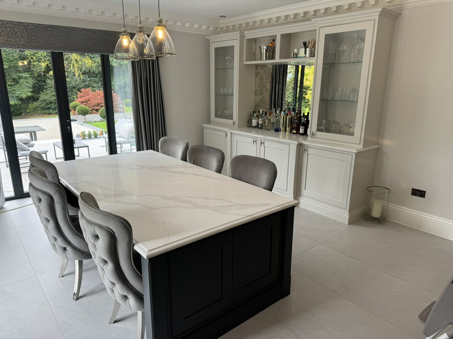 Navy island, glazed drinks dresser and bifold doors to the garden
