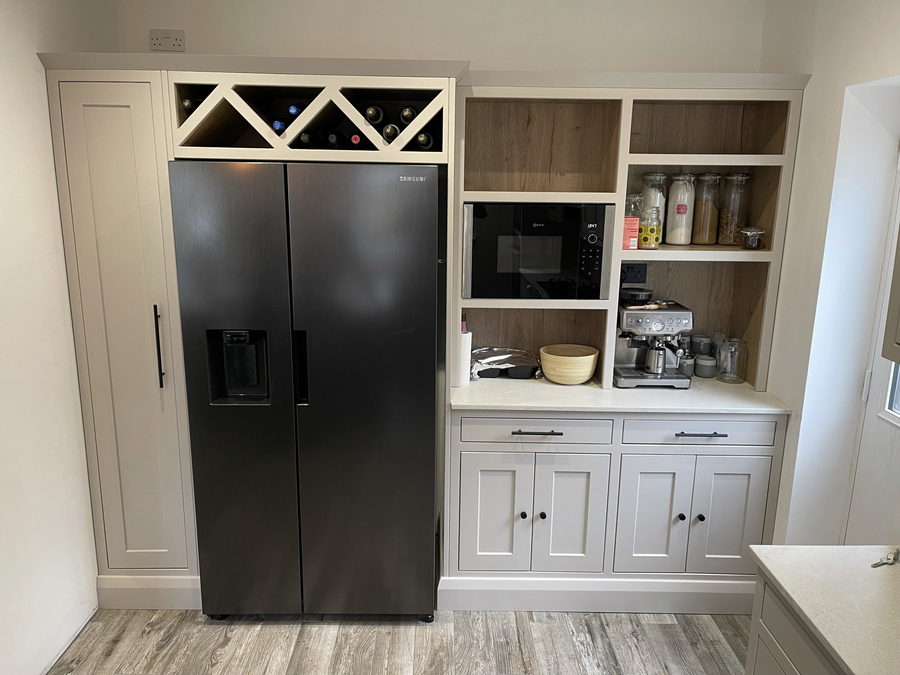 A dresser unit built around an American fridge with a criss-cross wine rack