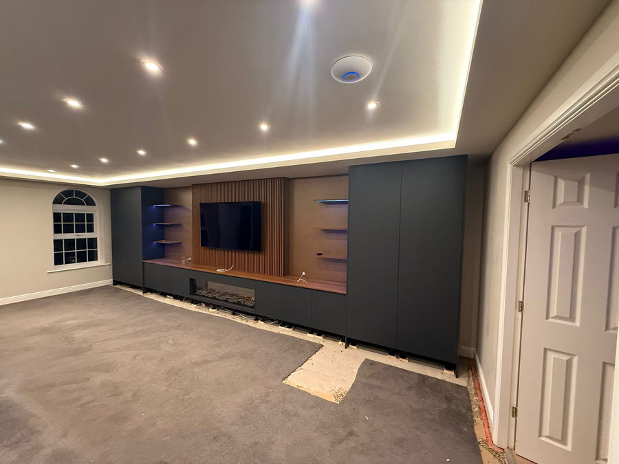 Oak-lined niches under a cove-lit coffered ceiling