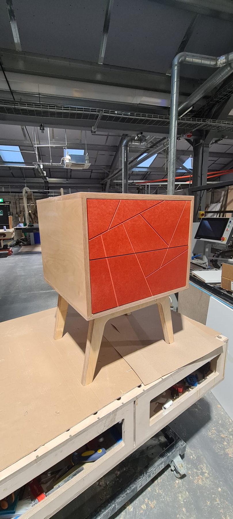 A faceted cabinet front, the pattern machined and then finished