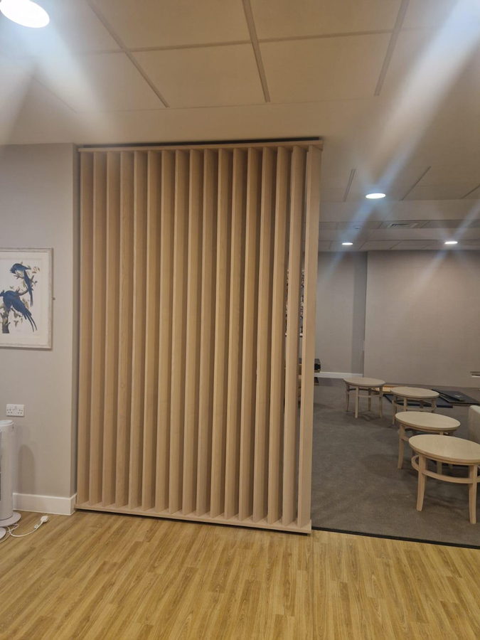 The same screen: slats recessed between a painted top and bottom batten