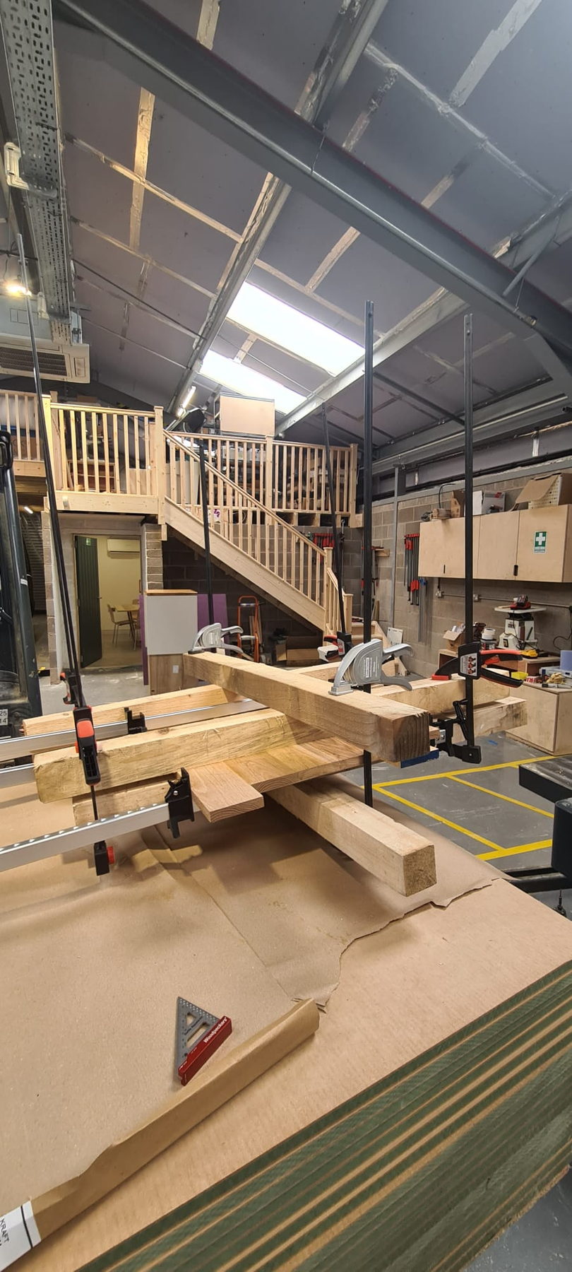 The workshop, with timber racking and the mezzanine behind