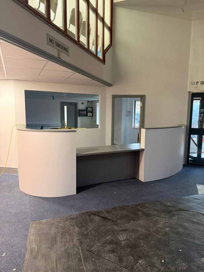 A second curved counter in a commercial foyer