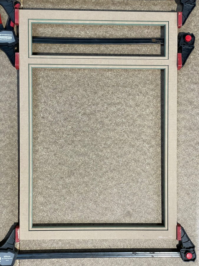 A mitred frame clamped up on the bench