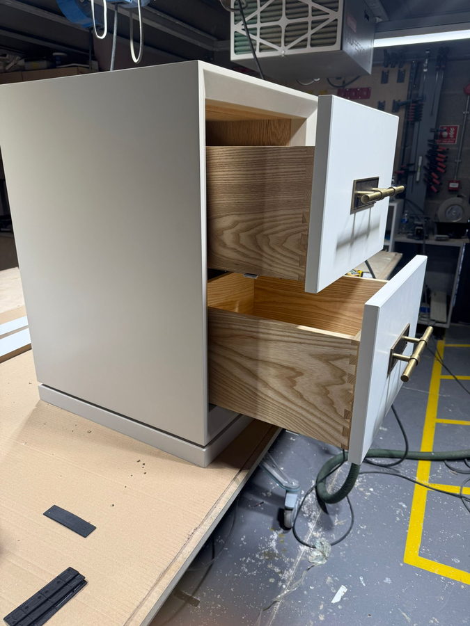 Oak drawer boxes pulled out of a finished carcass