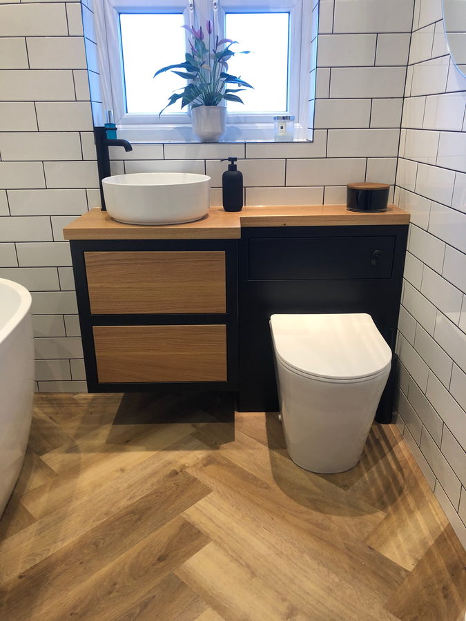 Vanity and WC unit together, with the bath beyond