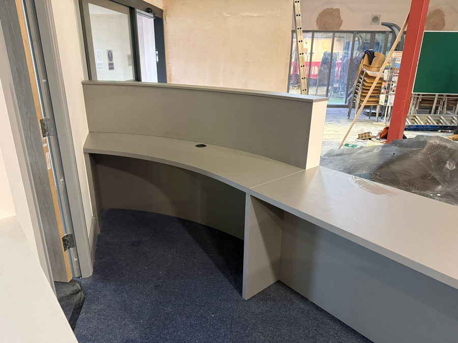The same reception desk being fitted