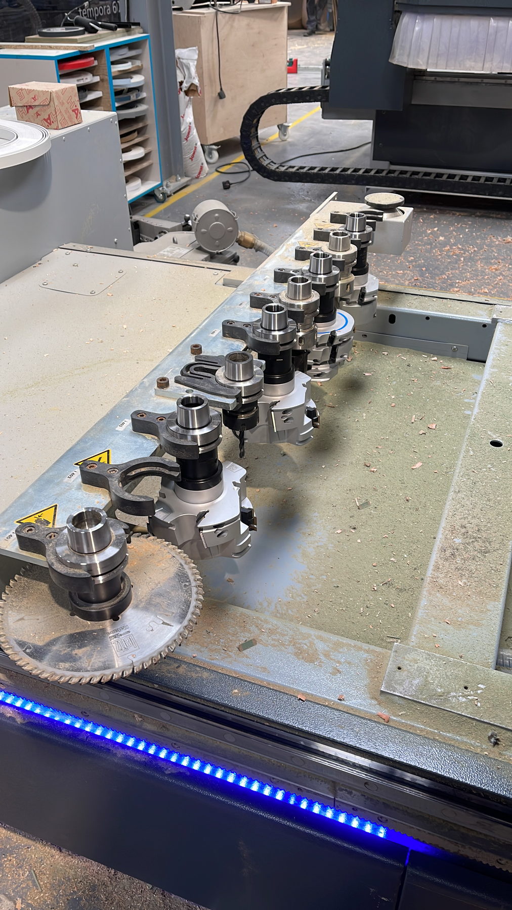 The tool changer loaded with cutters and a saw blade