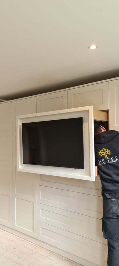 Setting a television frame into a panelled media wall