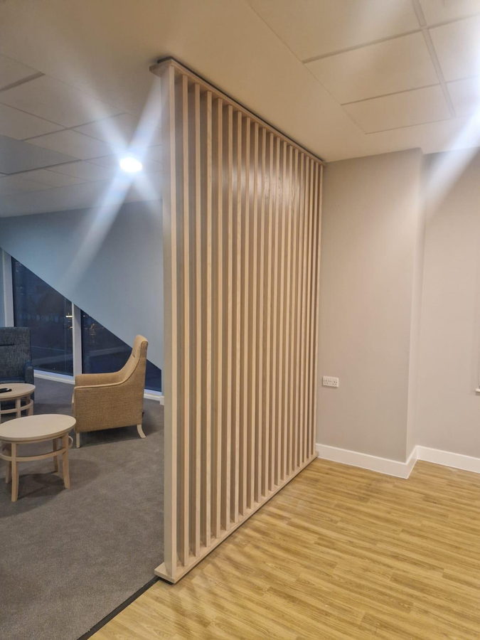 A second screen beside the seating area
