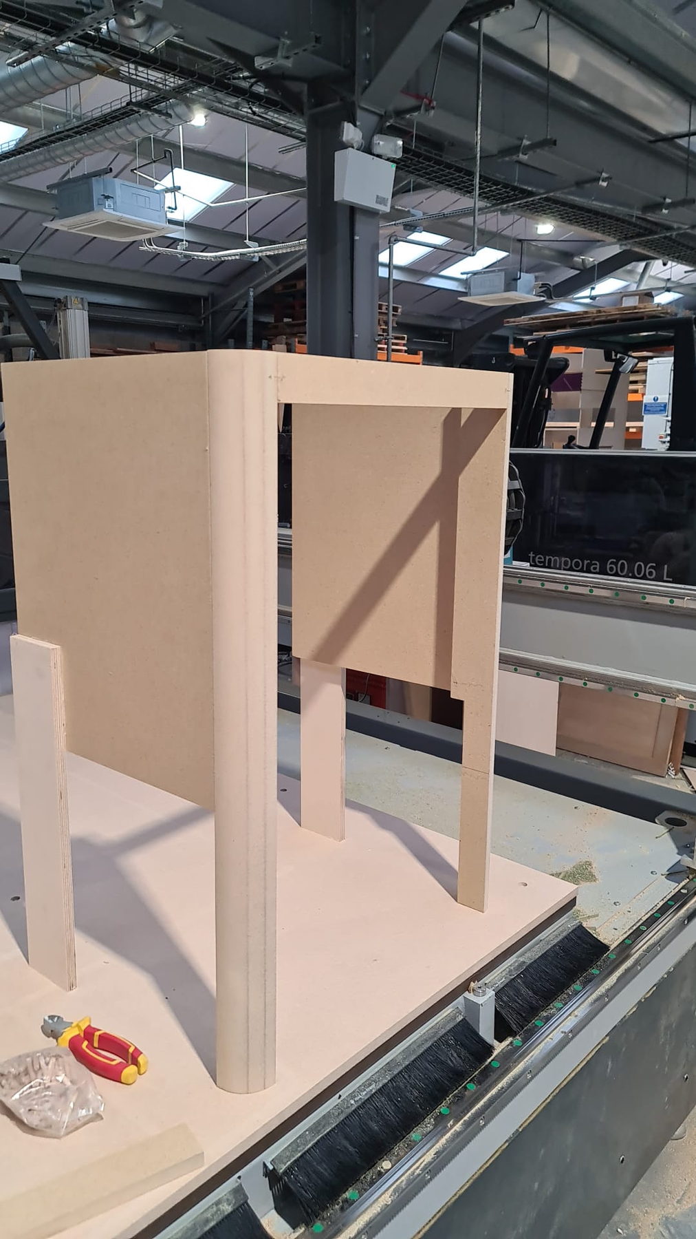 An arched frame part on the CNC table