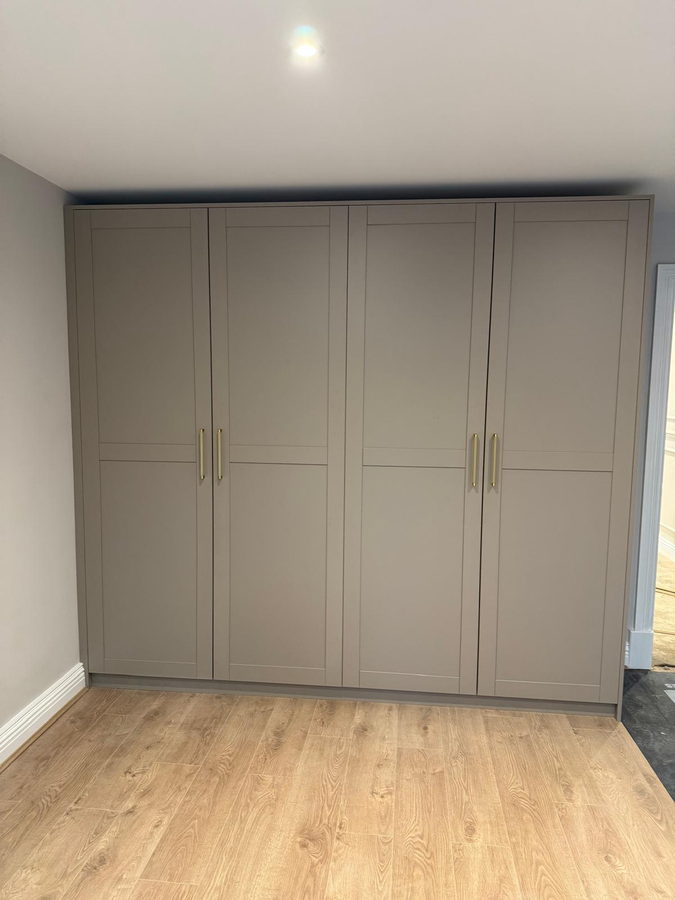Taupe shaker wardrobes, four doors, scribed to the wall