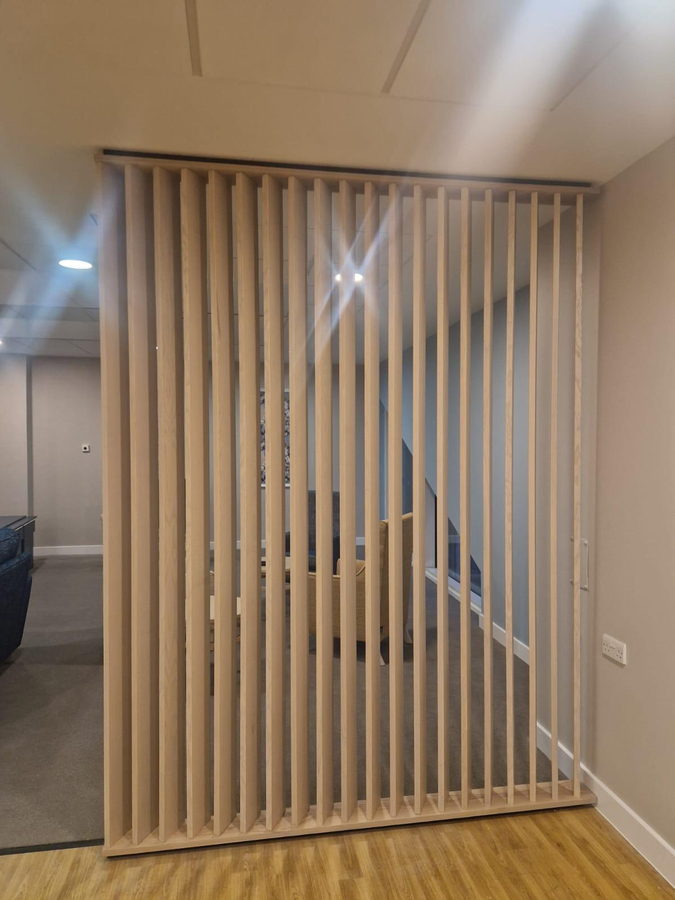 The same detail framing the hallway to the stairs