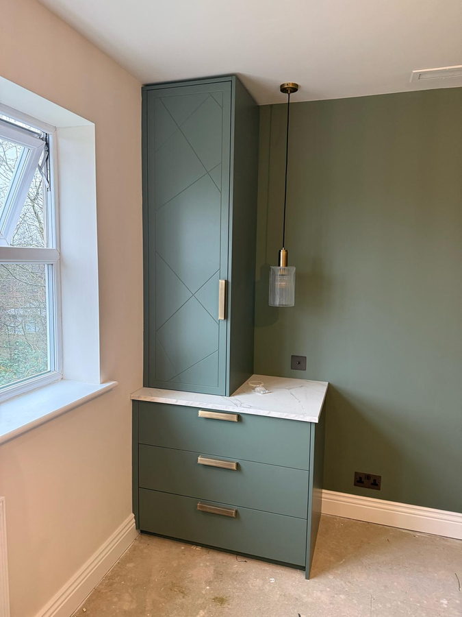 A matching drawer chest with diamond panelling, same room
