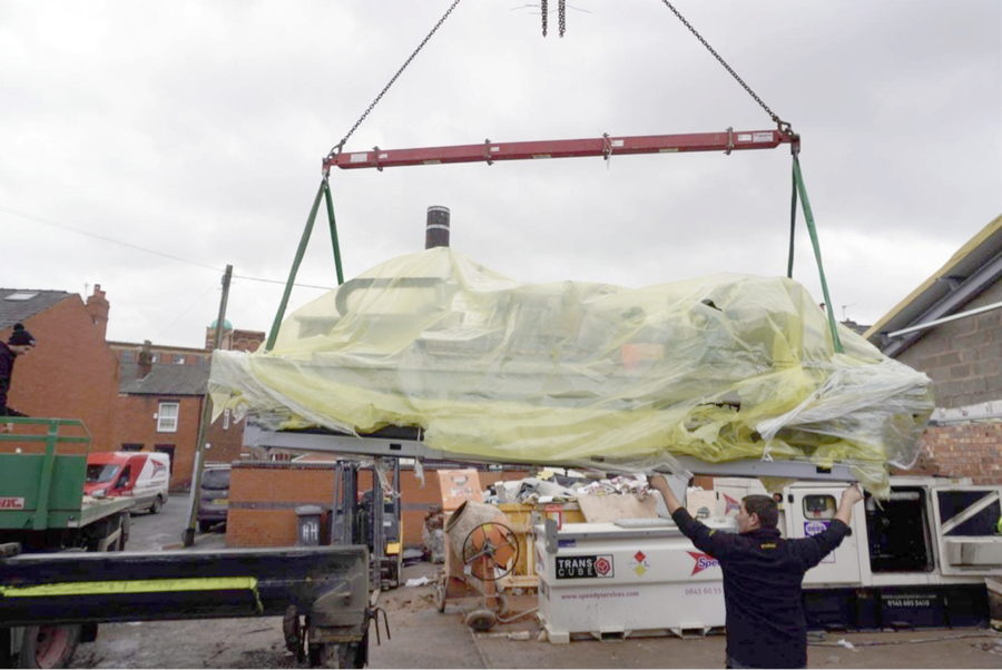 The machinery being craned into Progress Depot